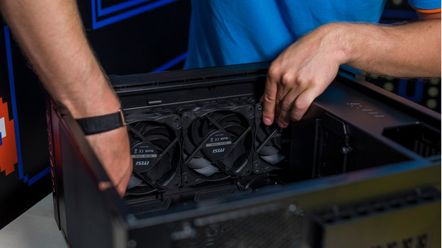 Expert places processor cooler in the case