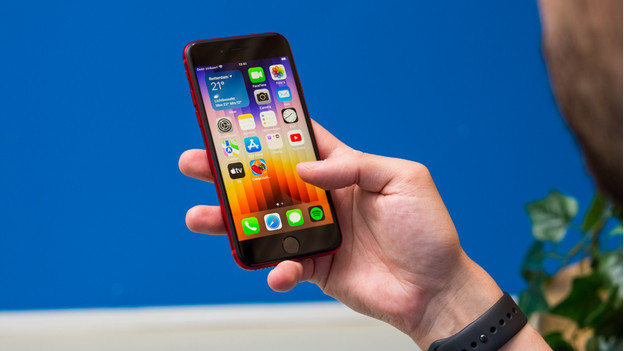 iPhone SE in hand