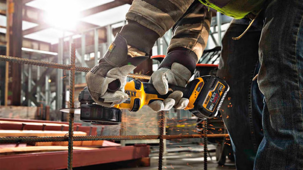 Man uses cordless angle grinder