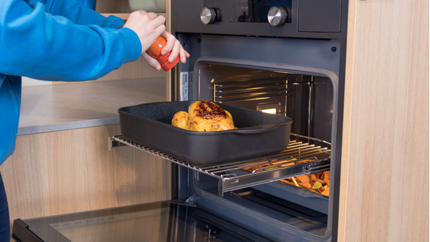 Baking sheet out of the oven with telescopic rails