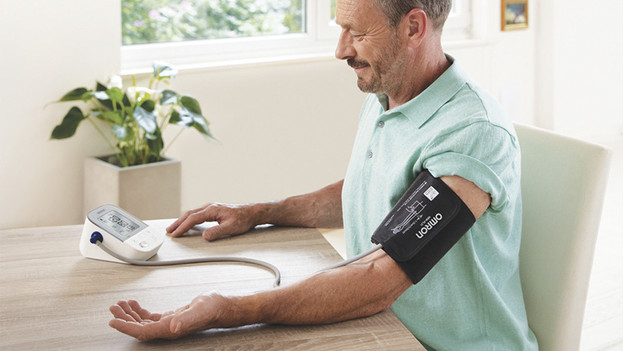 Blood pressure monitor around the upper arm