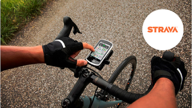 Hand presses the Garmin bike navigation