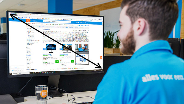 Expert works on a 24-inch monitor with an arrow indicating the size