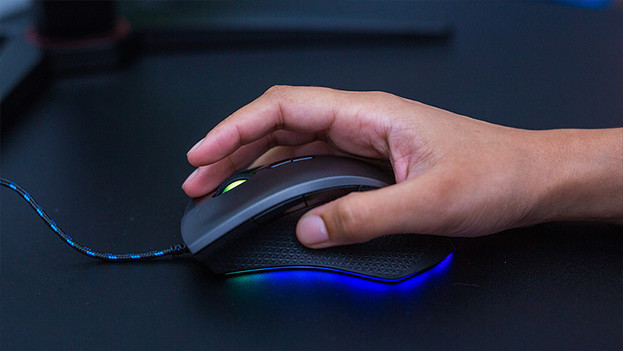 Female hand on gaming mouse