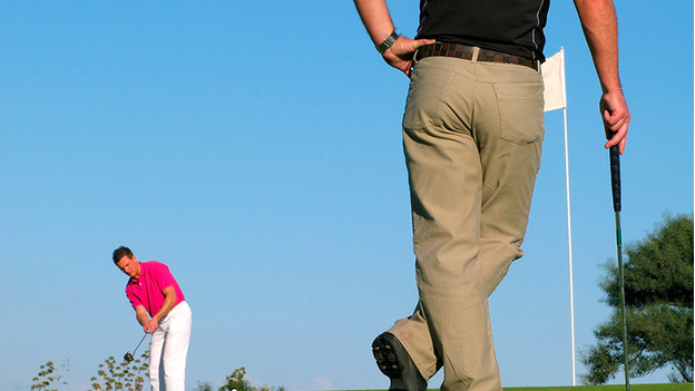 Golf players with sports watch