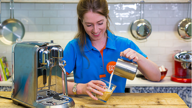 pour milk foam into cup