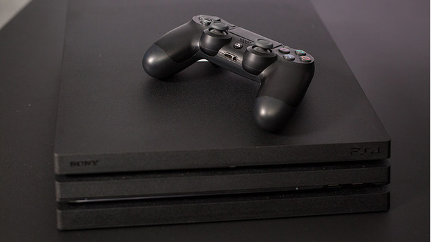 PlayStation 4 console with controller.