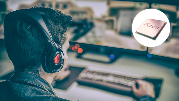 Man is playing video game with processor in a spotlight.