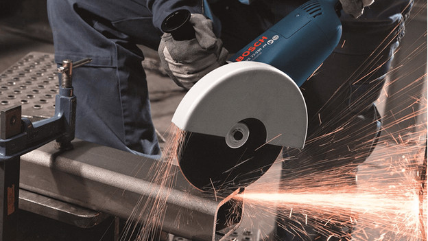 Angle grinder is being used on metal with lots of sparks