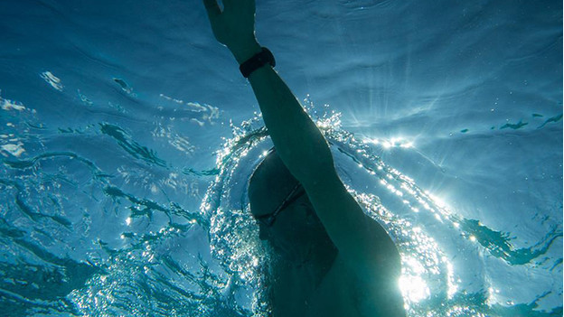 Swimmer with sports watch