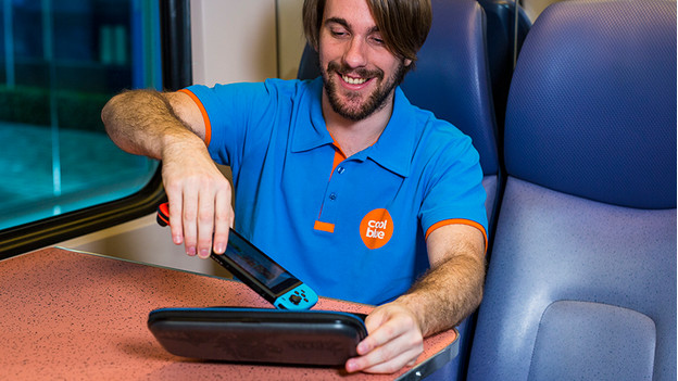 Put a Nintendo Switch in a case on the train.