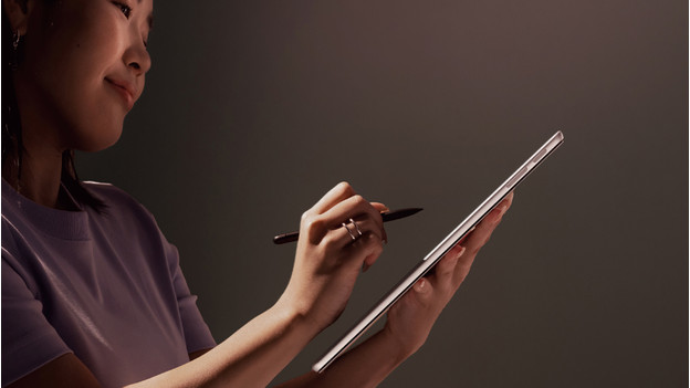 Someone using the touchscreen of a Surface laptop with the Surface pen