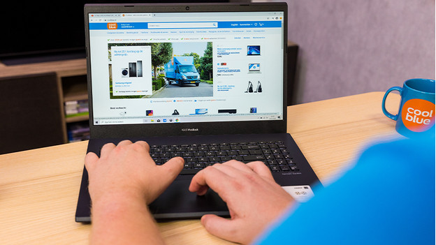 Employee works on an ASUS laptop.