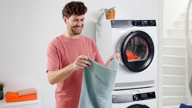 Person folds laundry