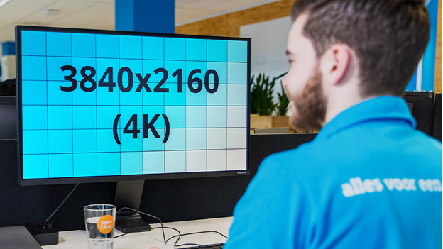 Expert working on a 4K monitor