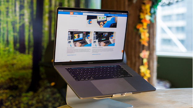 Apple MacBook on laptop stand
