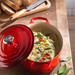 Le Creuset Oval Dutch Oven 27cm Cerise product in use