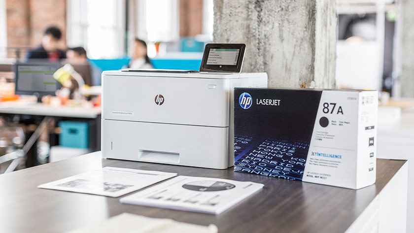 hp laser printer with toners on a table