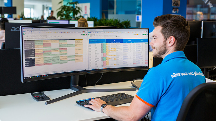 Expert working with a Samsung ultrawide monitor