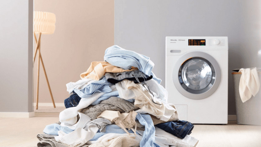 Washing machine with pile of laundry