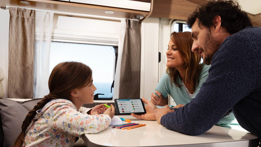 Family in camper with camper navigation