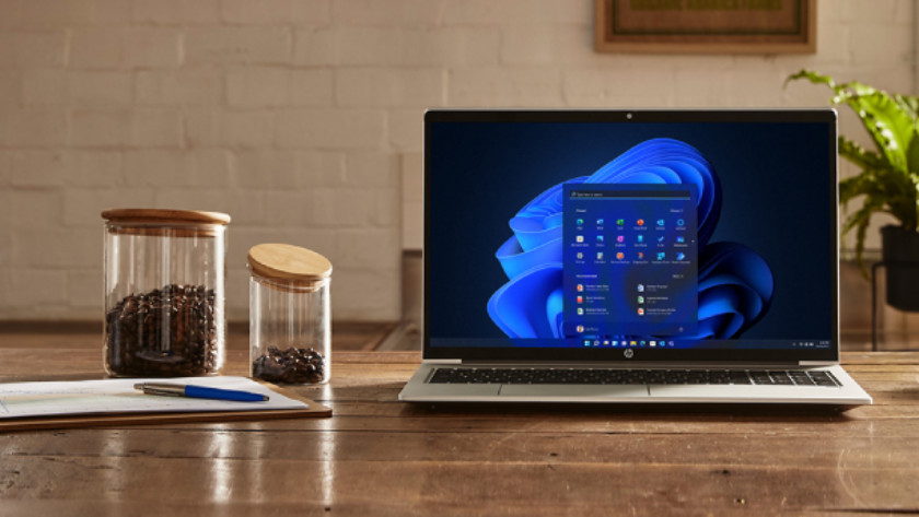 Business HP laptop with some coffee beans