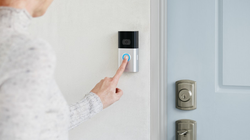 Visitor presses Ring doorbell