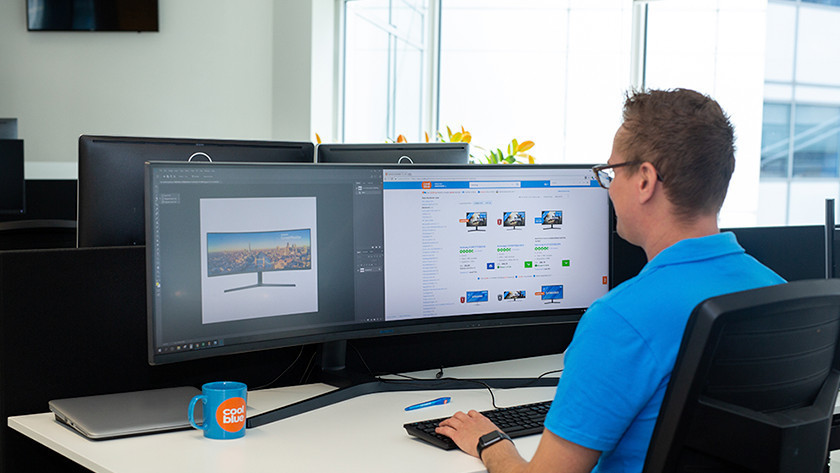 Expert working with a Philips ultrawide monitor