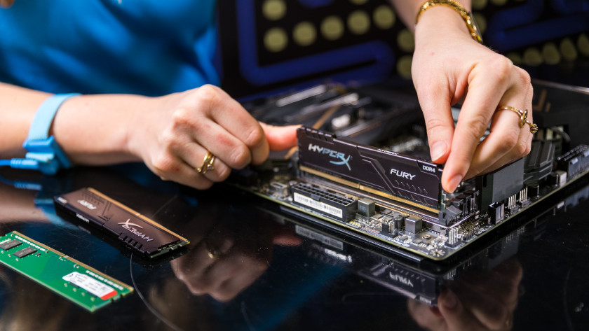 Expert installs new RAM on the motherboard