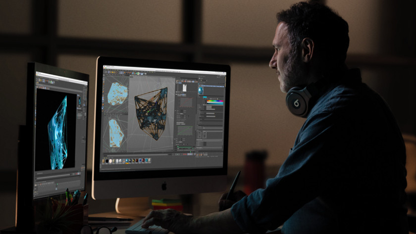 Man working on the Apple iMac 27 inches