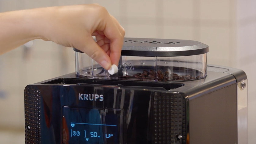 How do you clean the brew group of your Krups coffee machine