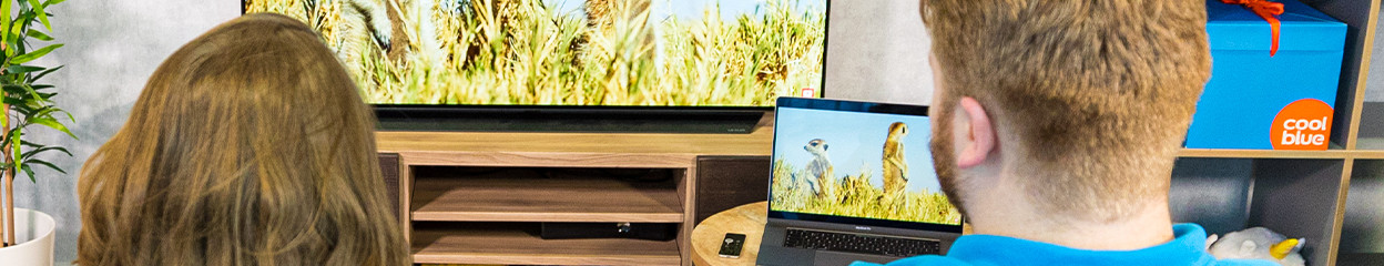 How do you stream videos and photos from your iPhone to your Apple TV?