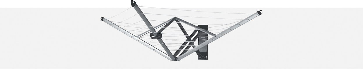 How do you place a wall-mounted umbrella drying rack?