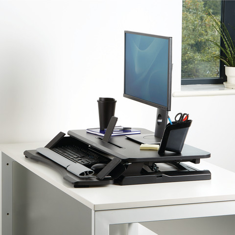 Fellowes Sit-Stand Workstation Black product in use