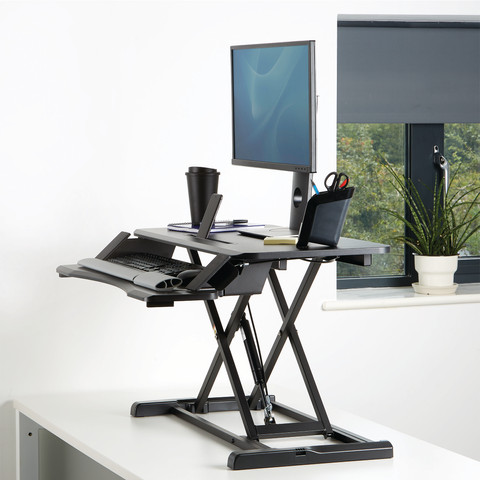 Fellowes Sit-Stand Workstation Black product in use