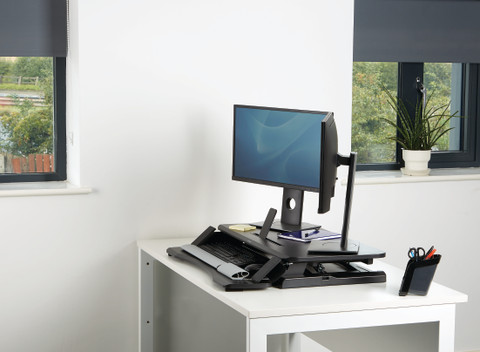 Fellowes Sit-Stand Workstation Black product in use