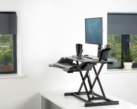 Fellowes Sit-Stand Workstation Black product in use