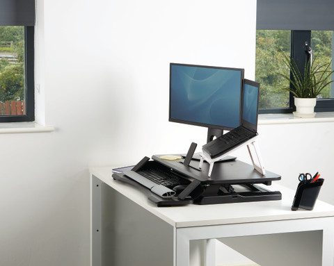 Fellowes Sit-Stand Workstation Black product in use