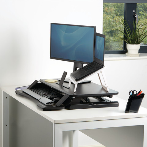 Fellowes Sit-Stand Workstation Black product in use