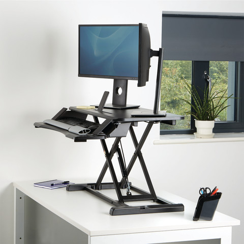 Fellowes Sit-Stand Workstation Black product in use