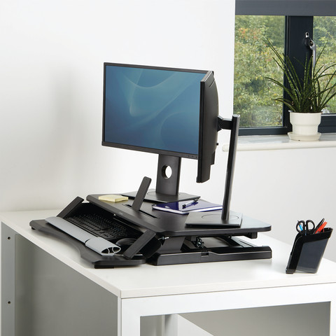 Fellowes Sit-Stand Workstation Black product in use