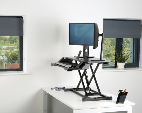 Fellowes Sit-Stand Workstation Black product in use