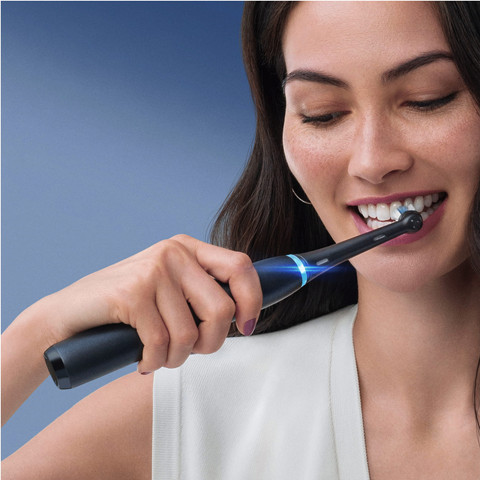 Oral-B iO Series 8 Black and White Duo Pack with Extra Brush Attachment product in use