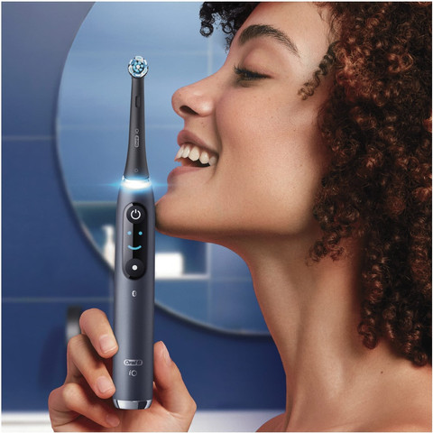 Oral-B iO 9N Black with Extra Brush Attachment product in use