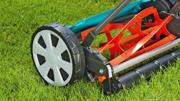 Mowing the lawn with a lawn mower