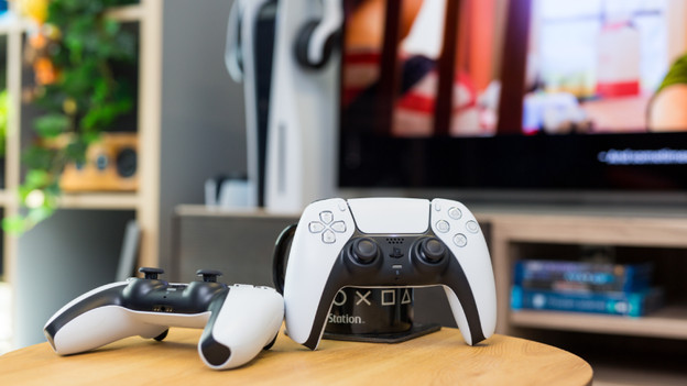 Controllers for the PlayStation 5 on a table