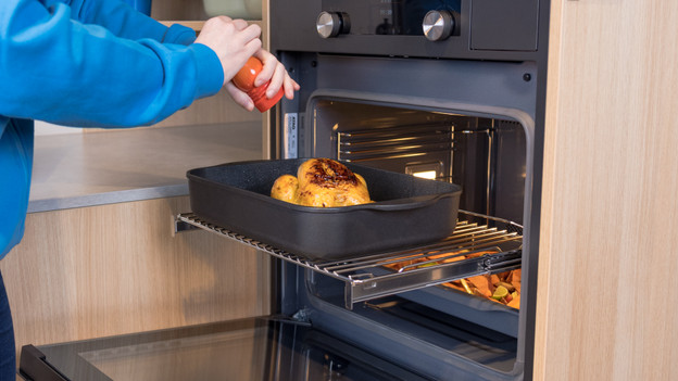 Baking sheet out of the oven with telescopic rails