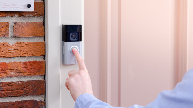 Ring doorbell hangs next to the door