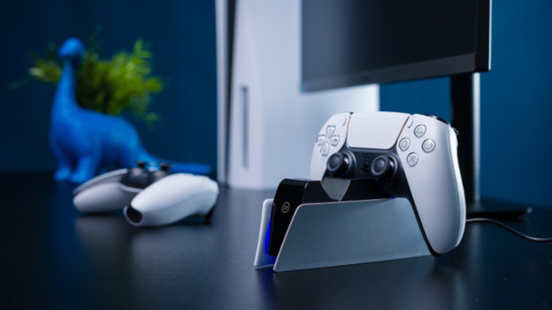 DualSense controller in BlueBuilt charging dock with a controller next to it