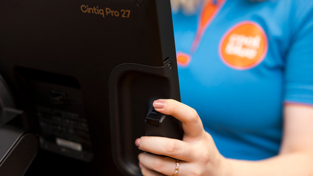 Expert presses the ExpressKeys on the back of the drawing tablet